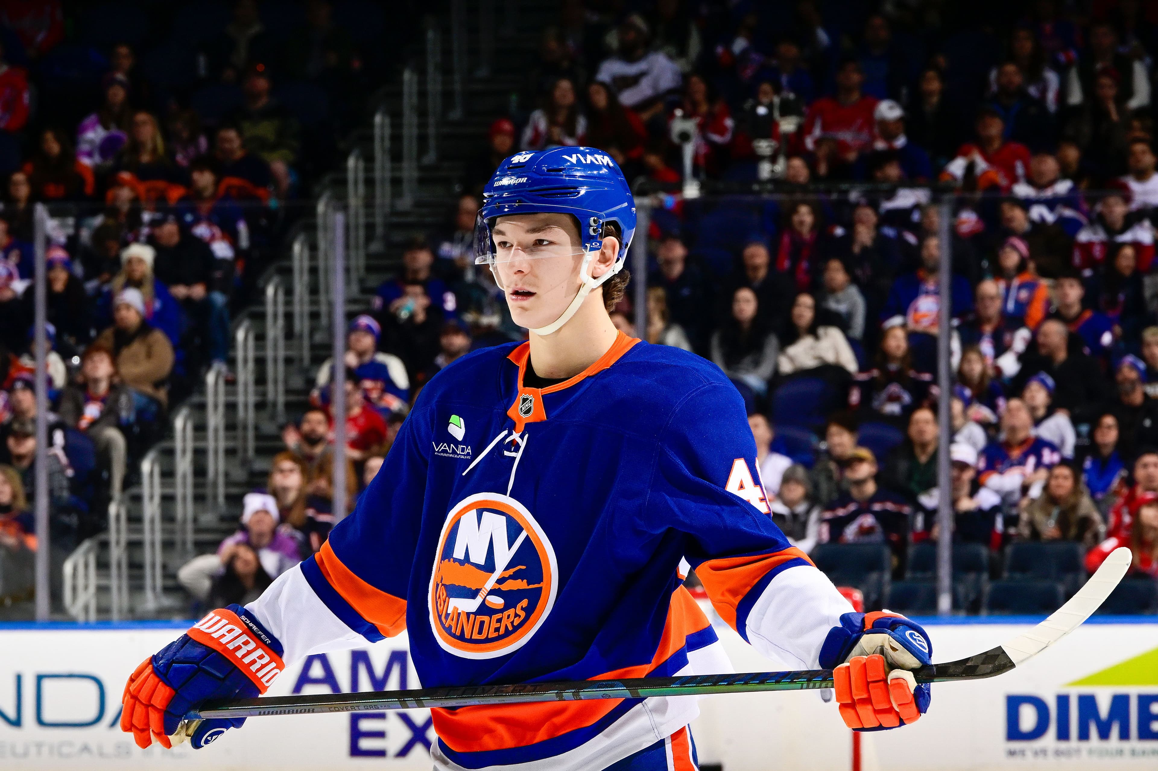 Matthew Schaefer of the New York Islanders signs on as Hockey Fights Cancer champion.